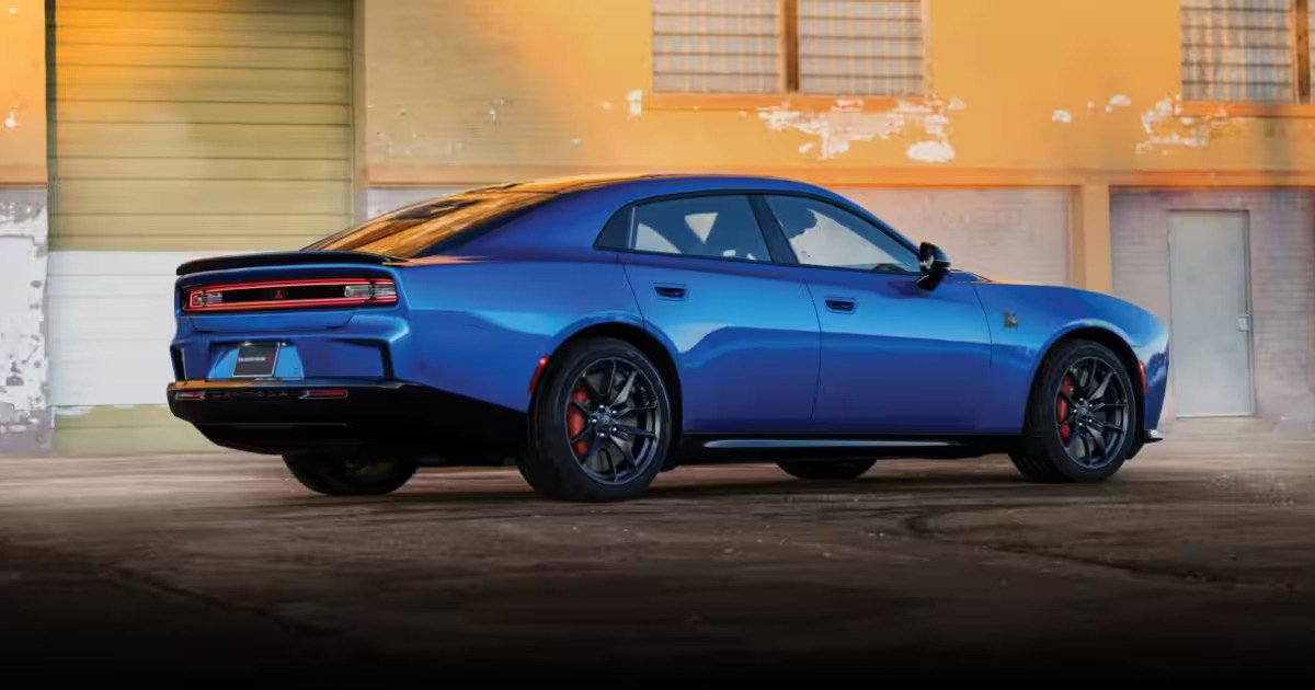 Blue 2026 Dodge Charger staged in front of an old building.