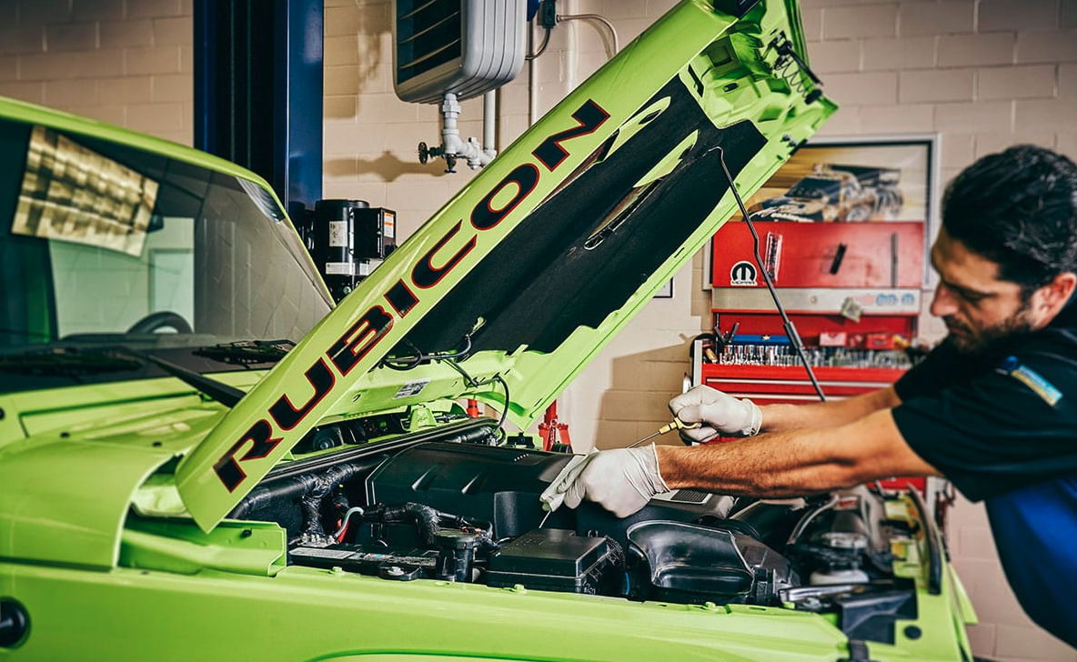 Changing oil on a Neon green Jeep Rubicon