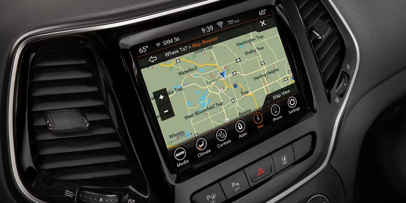 Used Jeep Cherokee interior showing Uconnect infotainment system