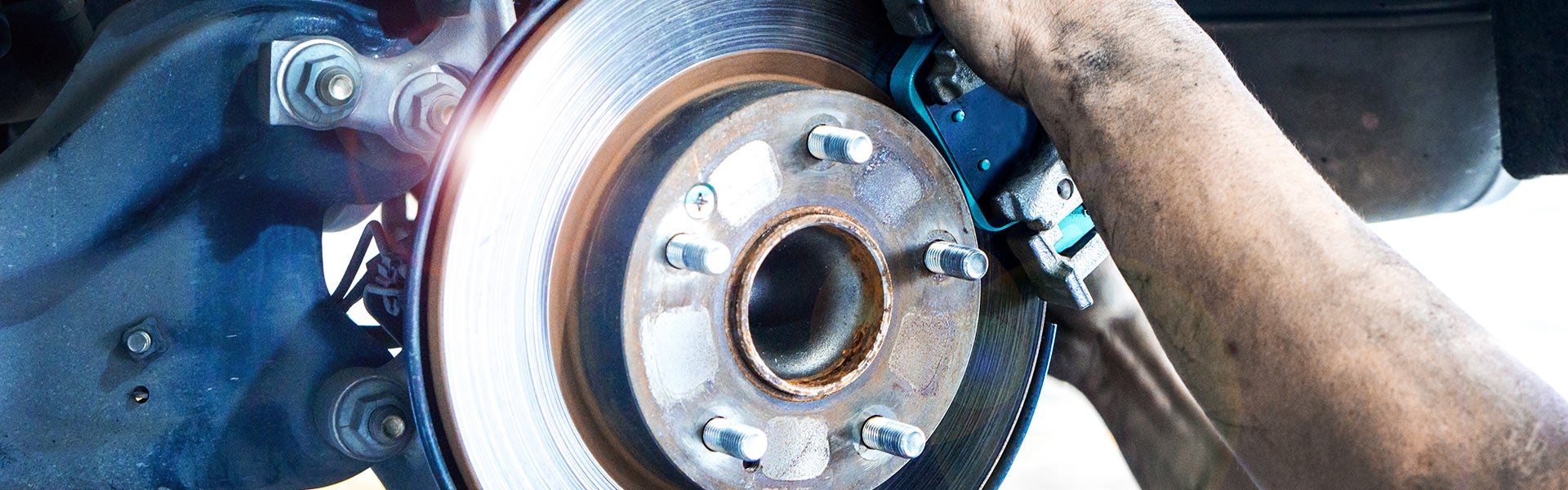 Cable Dahmer CDJR of Kansas City service center technician performing brake inspection