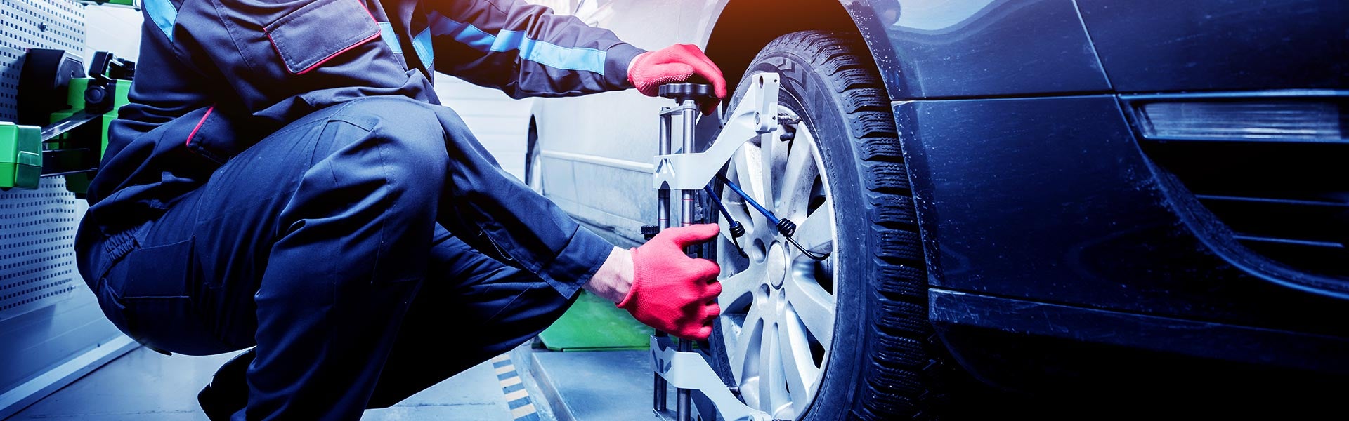 Technician mounting a new tire in the service center at Cable Dahmer CDJR of Kansas City